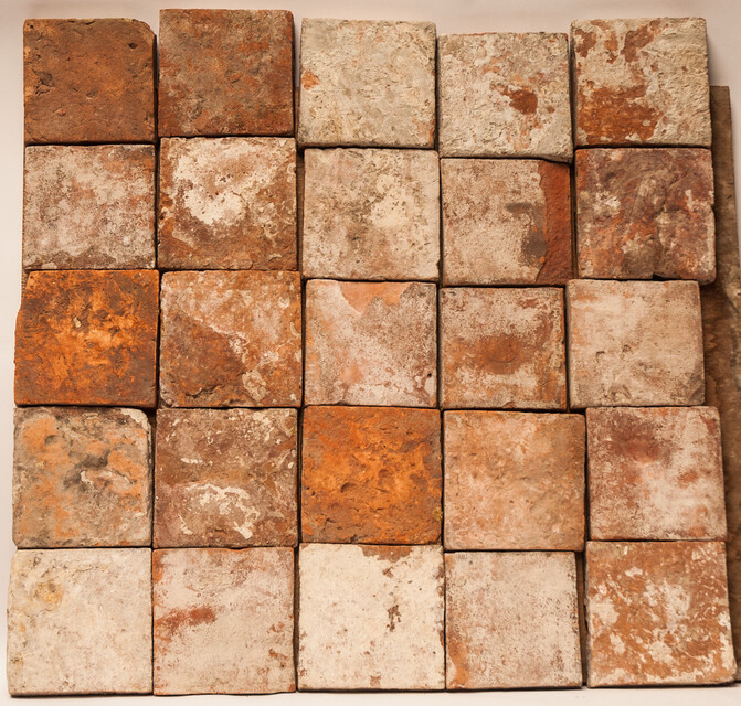 A collection of 25 glazed early seventeenth century ceramic floor tiles.