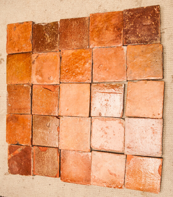 A collection of 25 glazed early seventeenth century ceramic floor tiles.