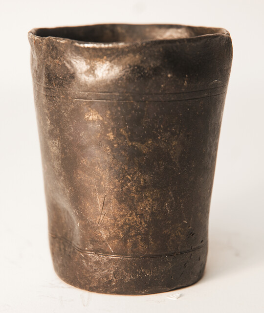 A heavy seventeenth Century Dutch pewter beaker hallmarked with a rose.