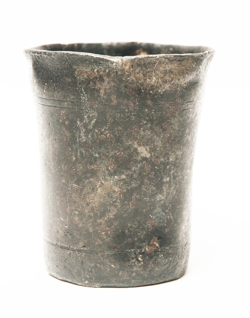 A heavy seventeenth Century Dutch pewter beaker hallmarked with a rose.