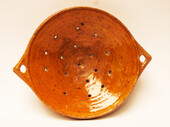 A large eighteenth century earthenware strainer made in Bergen Op Zoom.