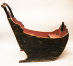 A nineteenth century childs push sled of Geesje de Vries with the coat of arms of Enkhuizen.