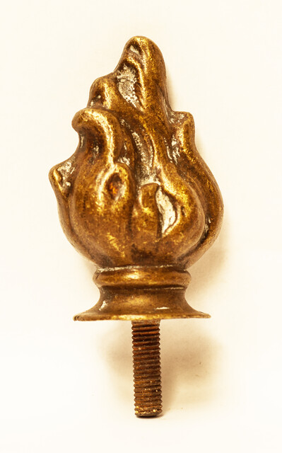 A nineteenth century solid brass top ornament.