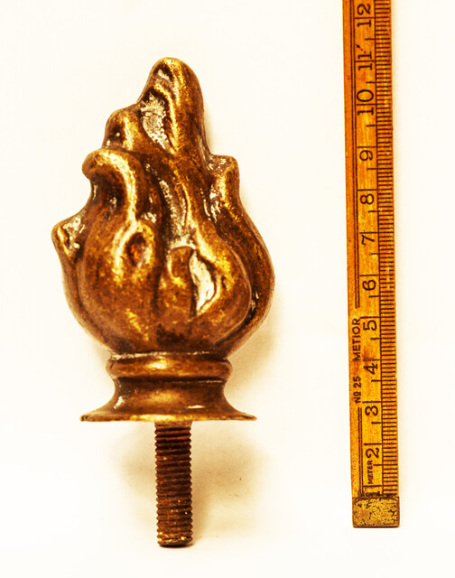 A nineteenth century solid brass top ornament.