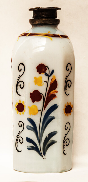 A rare eightteenth century opaline Bohemian bottle with cold enamel painting of flowers and a heart with two doves. With original pewter screw on top.