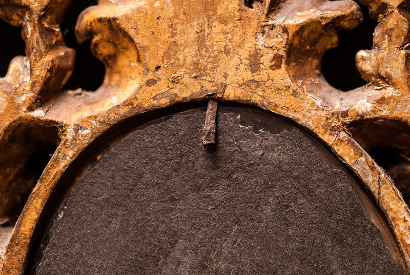 A seventeenth century Dutch mercury mirror in a gilt frame.