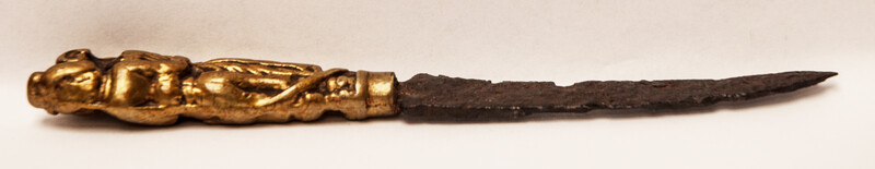 A seventeenth century knife with a brass handle showing a lady and a gentleman.