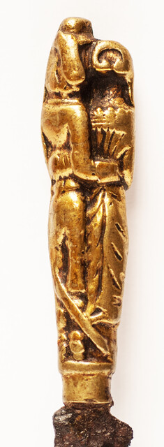 A seventeenth century knife with a brass handle showing a lady and a gentleman.