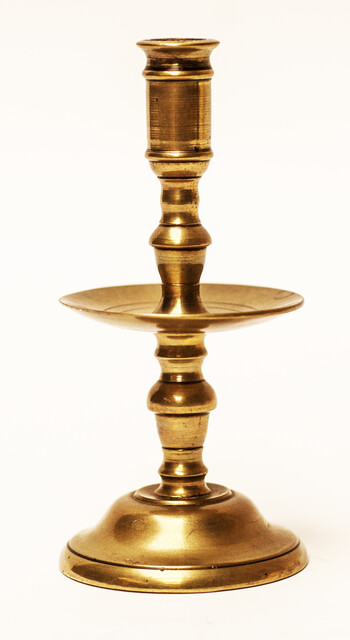 A small eighteenth century brass candlestick.