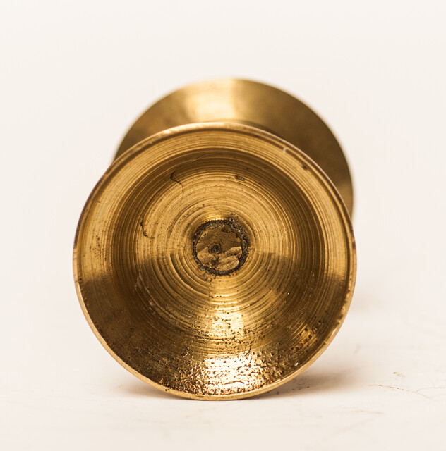 A small eighteenth century brass candlestick.