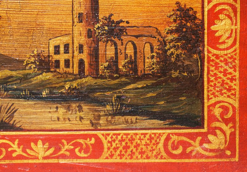 A small nineteenth century serving tray with a handpainted Italianate landscape.