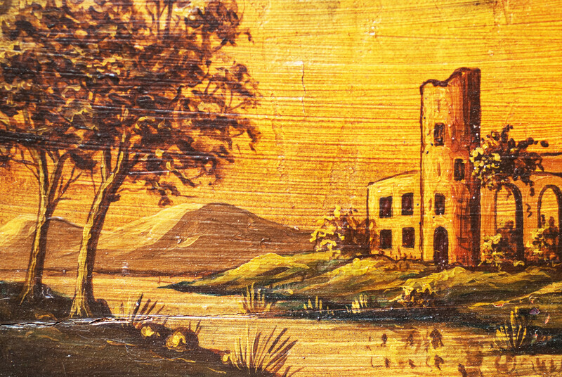 A small nineteenth century serving tray with a handpainted Italianate landscape.