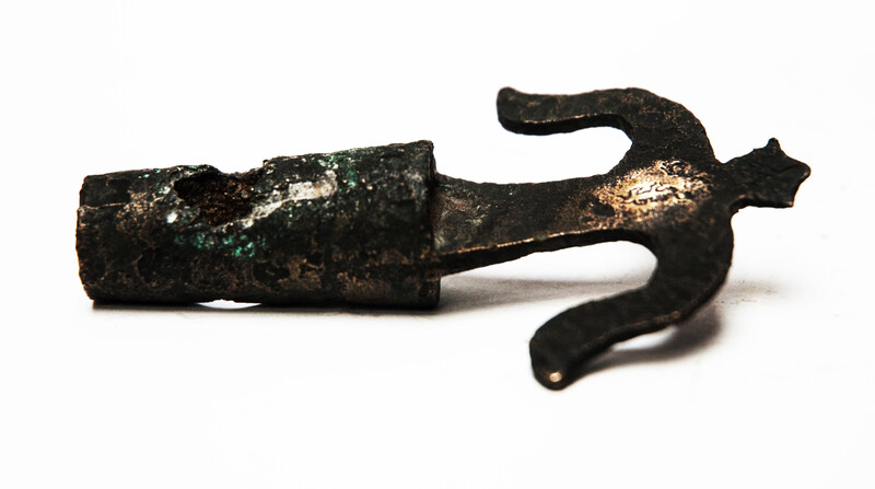 An early seventeenth century bronze faucet stop with a clear makers mark.