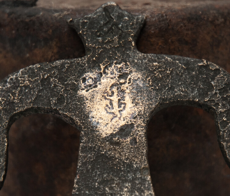 An early seventeenth century bronze faucet stop with a clear makers mark.