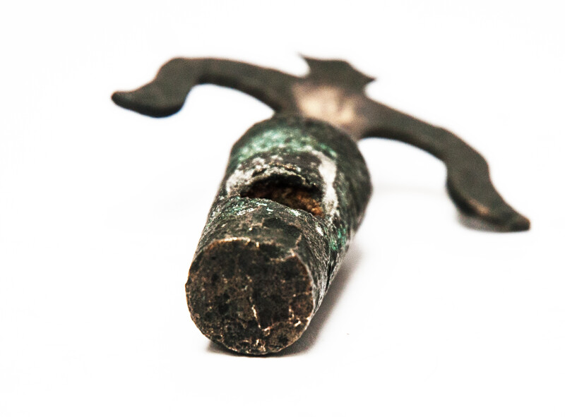 An early seventeenth century bronze faucet stop with a clear makers mark.