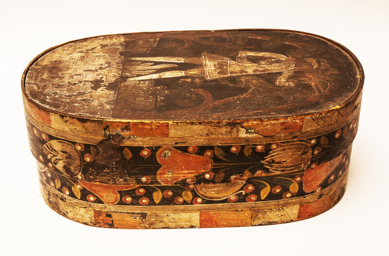 An early seventeenth century painted box with a gentleman and underneath a German text.