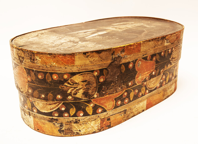 An early seventeenth century painted box with a gentleman and underneath a German text.