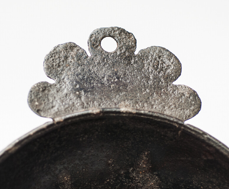 An early seventeenth century pewter porridge bowl with a rose hallmark.