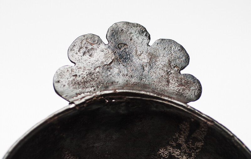 An early seventeenth century pewter porridge bowl with a rose hallmark.