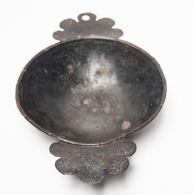 An early seventeenth century pewter porridge bowl with a rose hallmark.