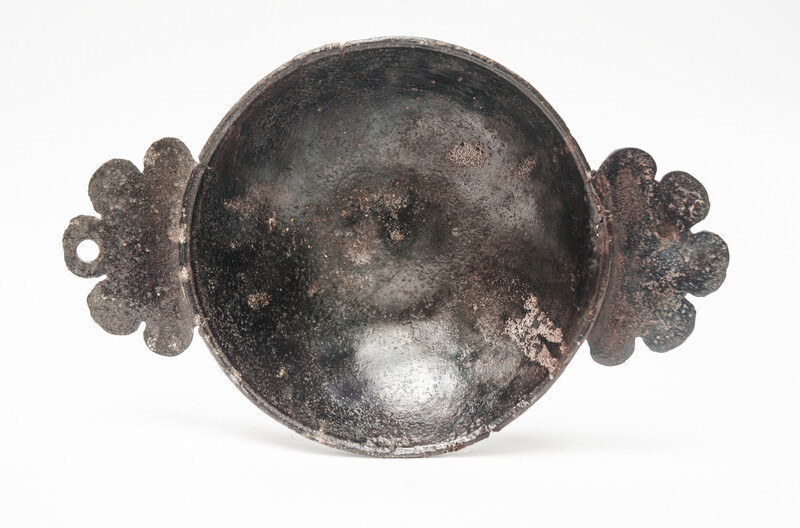 An early seventeenth century pewter porridge bowl with a rose hallmark.