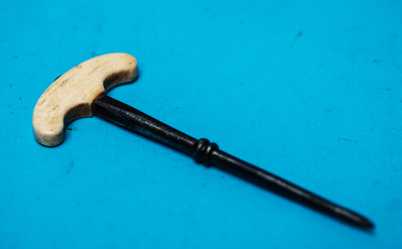 An eighteenth century hand drill with a bone handle.