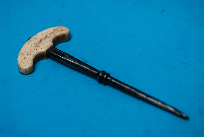 An eighteenth century hand drill with a bone handle.