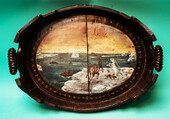 An eighteenth century serving tray from Zaandam commemorating the Dutch overwinter of Willem Barendts and Jacob van Heemskerk on the Russian Nova Zembla archipel in 1596-1597.