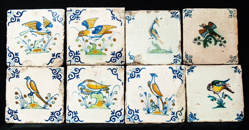 Eight very rare early 17th C Delft coloured tiles with birds.